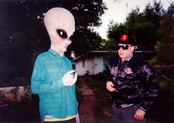 Extraterrestrial art dealer G'Nyd Ayreen and notorious Galaxy Editor E.J. Gold